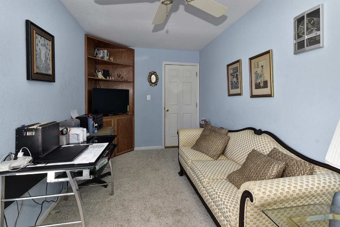 4525 Bell Springs Road Dripping Springs, TX 78620 - Photo 19 of 38 a living room with furniture and a flat screen tv