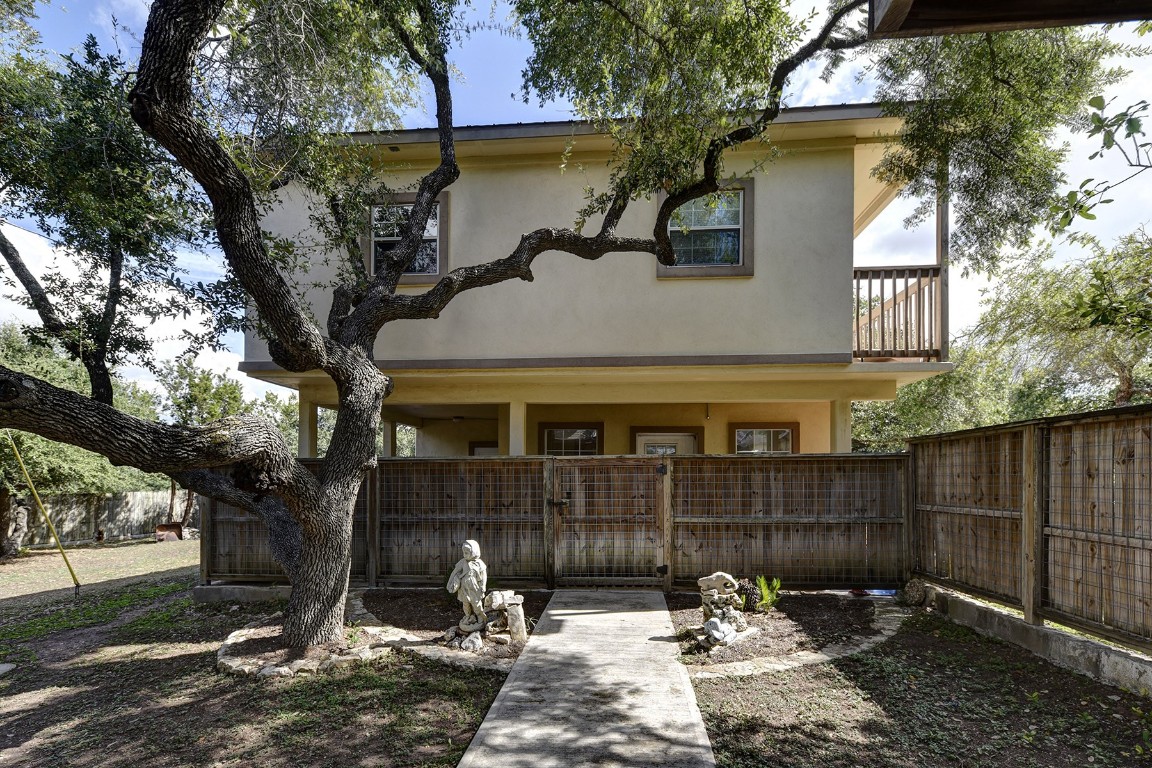 4525 Bell Springs Road Dripping Springs, TX 78620 - Photo 24 of 38 a front view of a house with garden