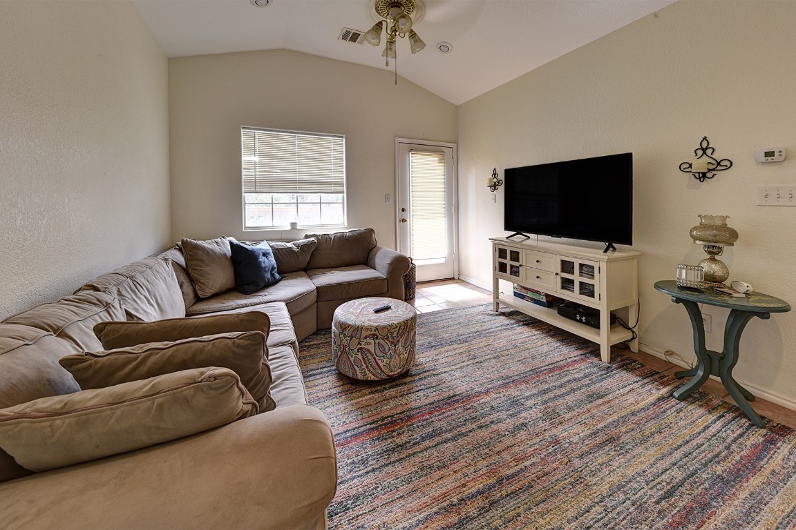 4525 Bell Springs Road Dripping Springs, TX 78620 - Photo 27 of 38 a living room with furniture and a flat screen tv