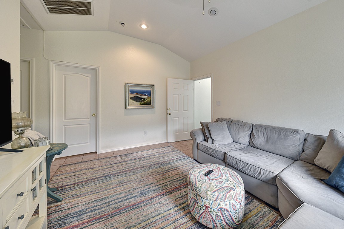 4525 Bell Springs Road Dripping Springs, TX 78620 - Photo 28 of 38 a living room with furniture and a flat screen tv