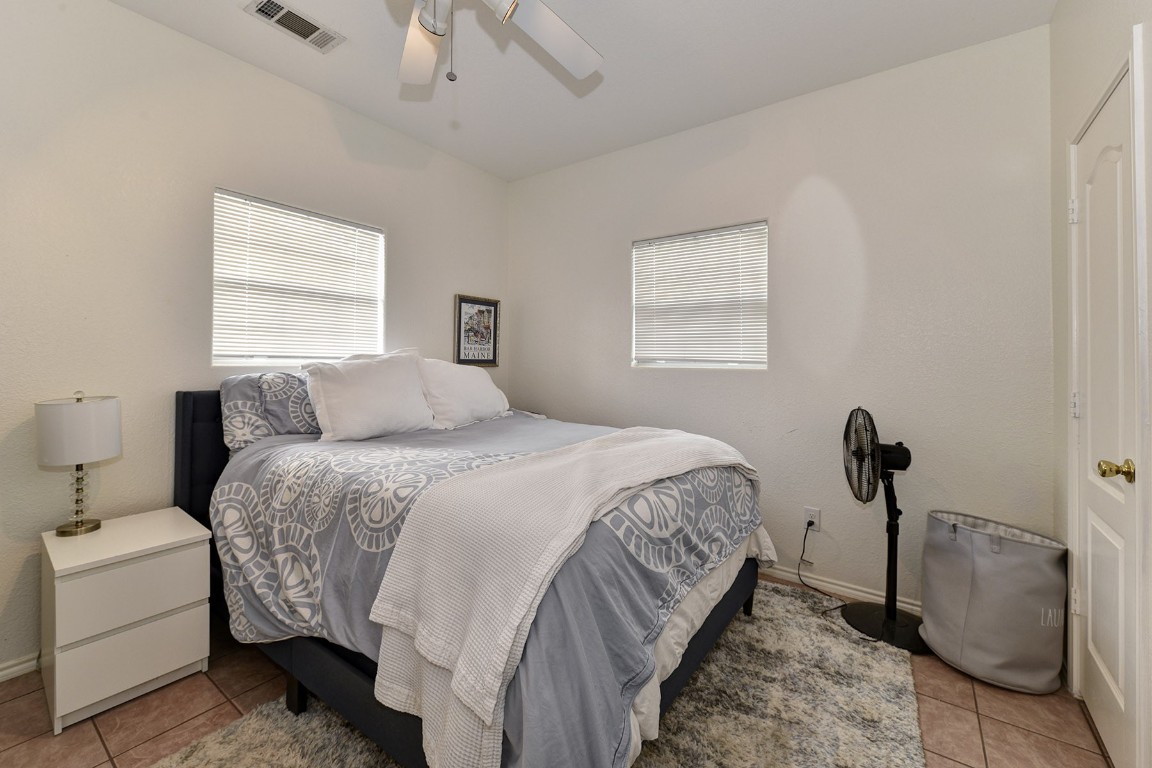 4525 Bell Springs Road Dripping Springs, TX 78620 - Photo 29 of 38 a bedroom with a bed and a window