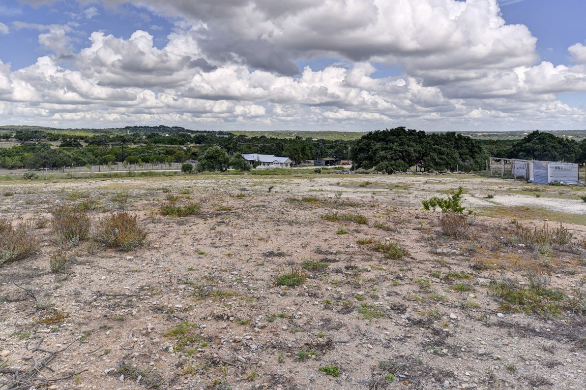 4525 Bell Springs Road Dripping Springs, TX 78620 - Photo 33 of 38 a view of outdoor space with green field and trees