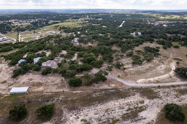 an aerial view of house with yard