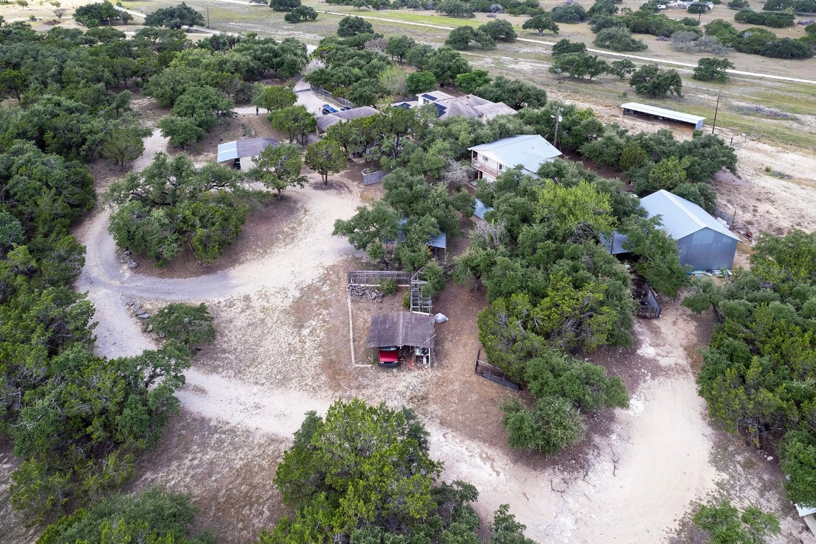 4525 Bell Springs Road Dripping Springs, TX 78620 - Photo 36 of 38 an aerial view of residential house with outdoor space and trees all around