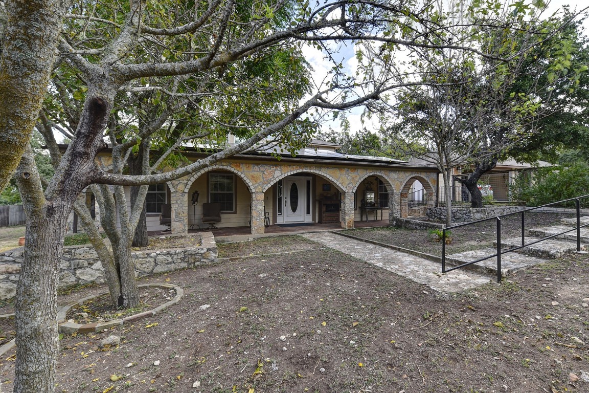 4525 Bell Springs Road Dripping Springs, TX 78620 - Photo 6 of 38 a front view of a house with garden