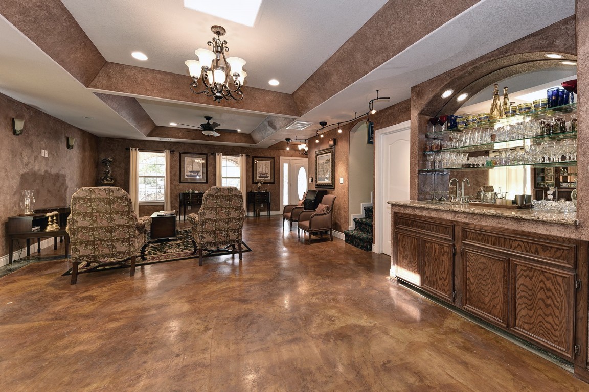 4525 Bell Springs Road Dripping Springs, TX 78620 - Photo 8 of 38 a large room with lots of furniture and chandelier