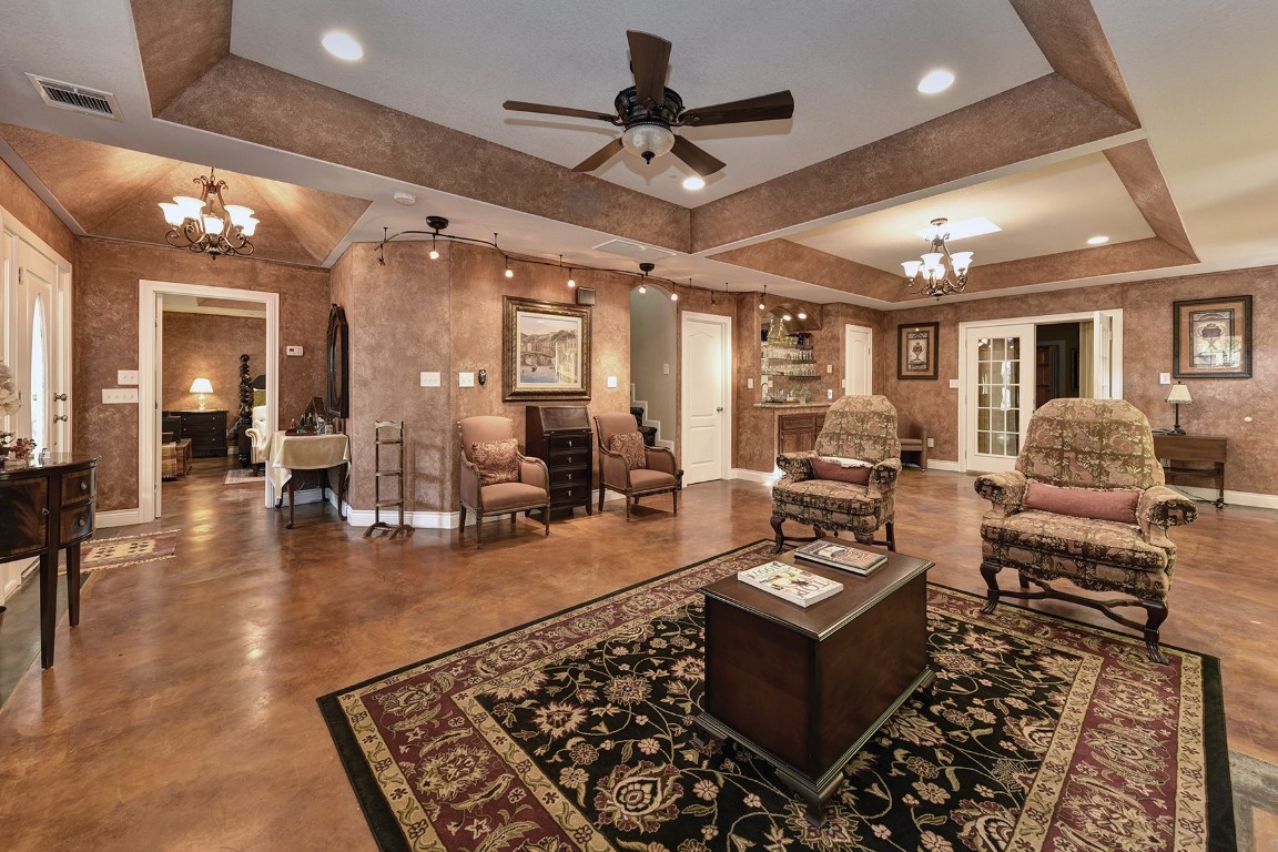 4525 Bell Springs Road Dripping Springs, TX 78620 - Photo 9 of 38 a living room with furniture and a chandelier