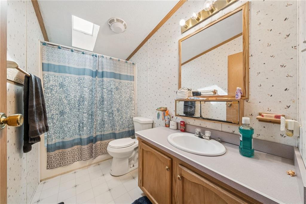 275 Adamik Road Clarksville, PA 15322 - Photo 24 of 39 a bathroom with a sink a toilet and shower