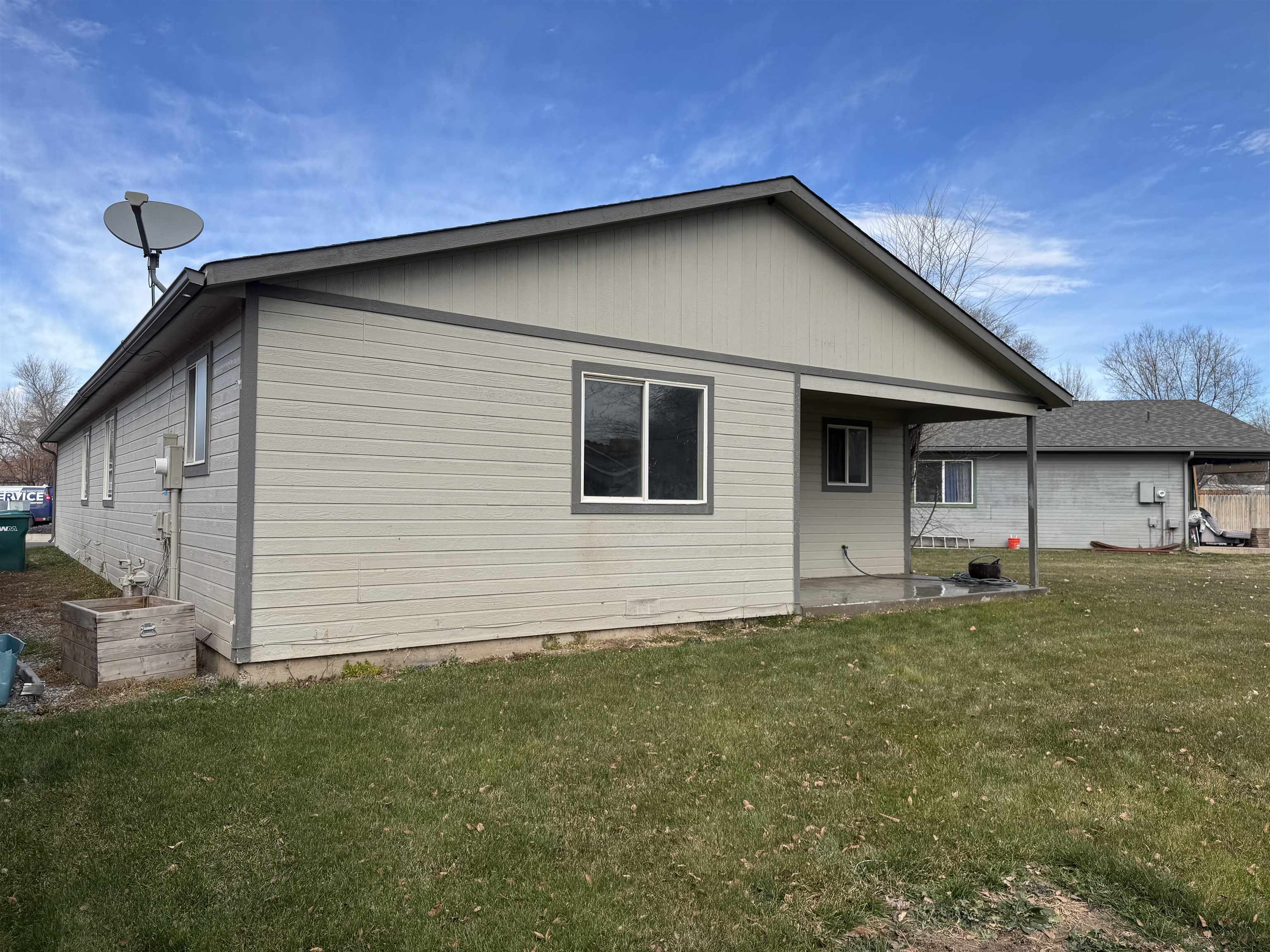 516 Vermont Lane Fruita, CO 81521 - Photo 12 of 13 a front view of a house with a yard