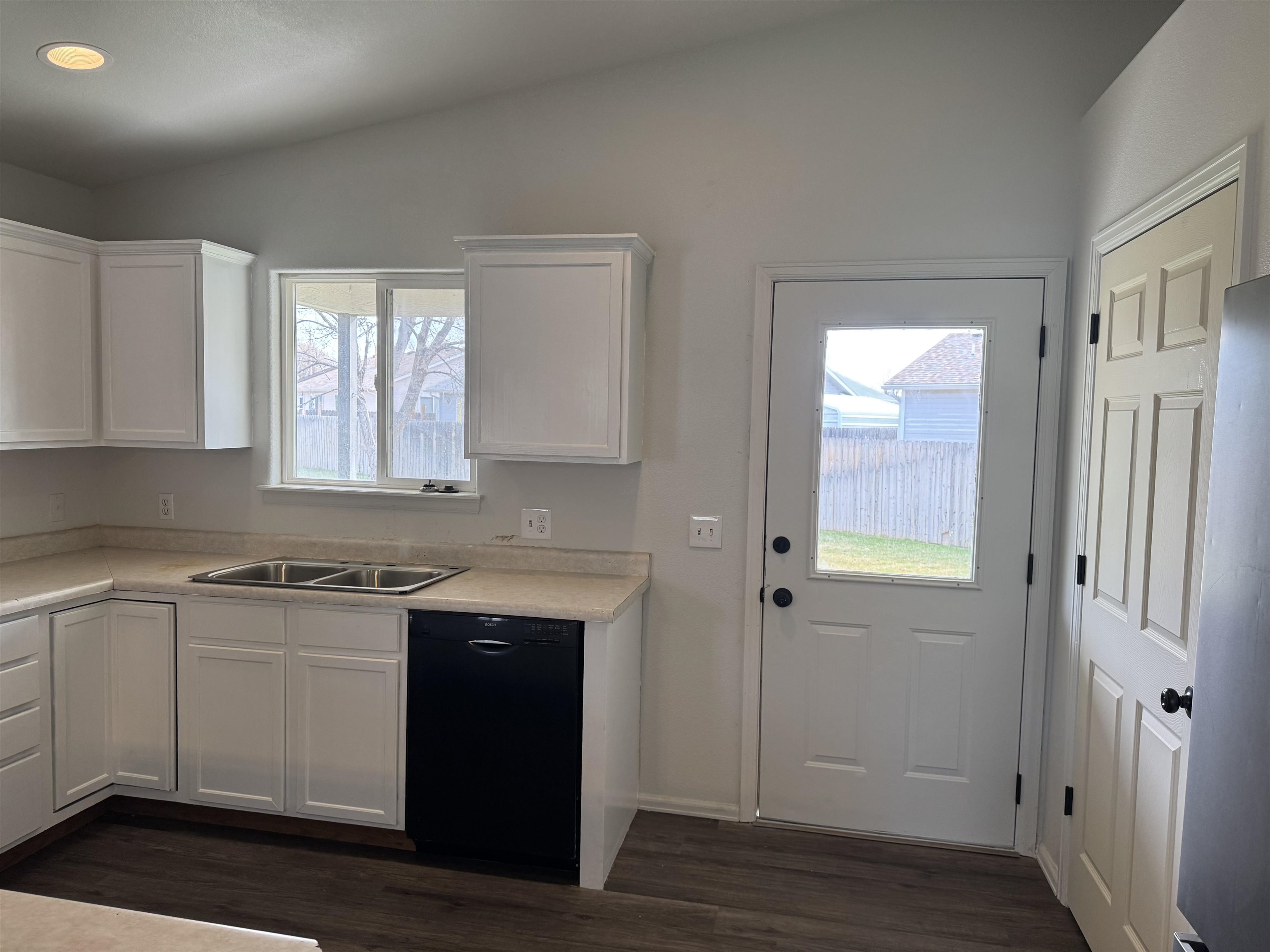 516 Vermont Lane Fruita, CO 81521 - Photo 4 of 13 a view of a kitchen with a sink cabinets and wooden floor
