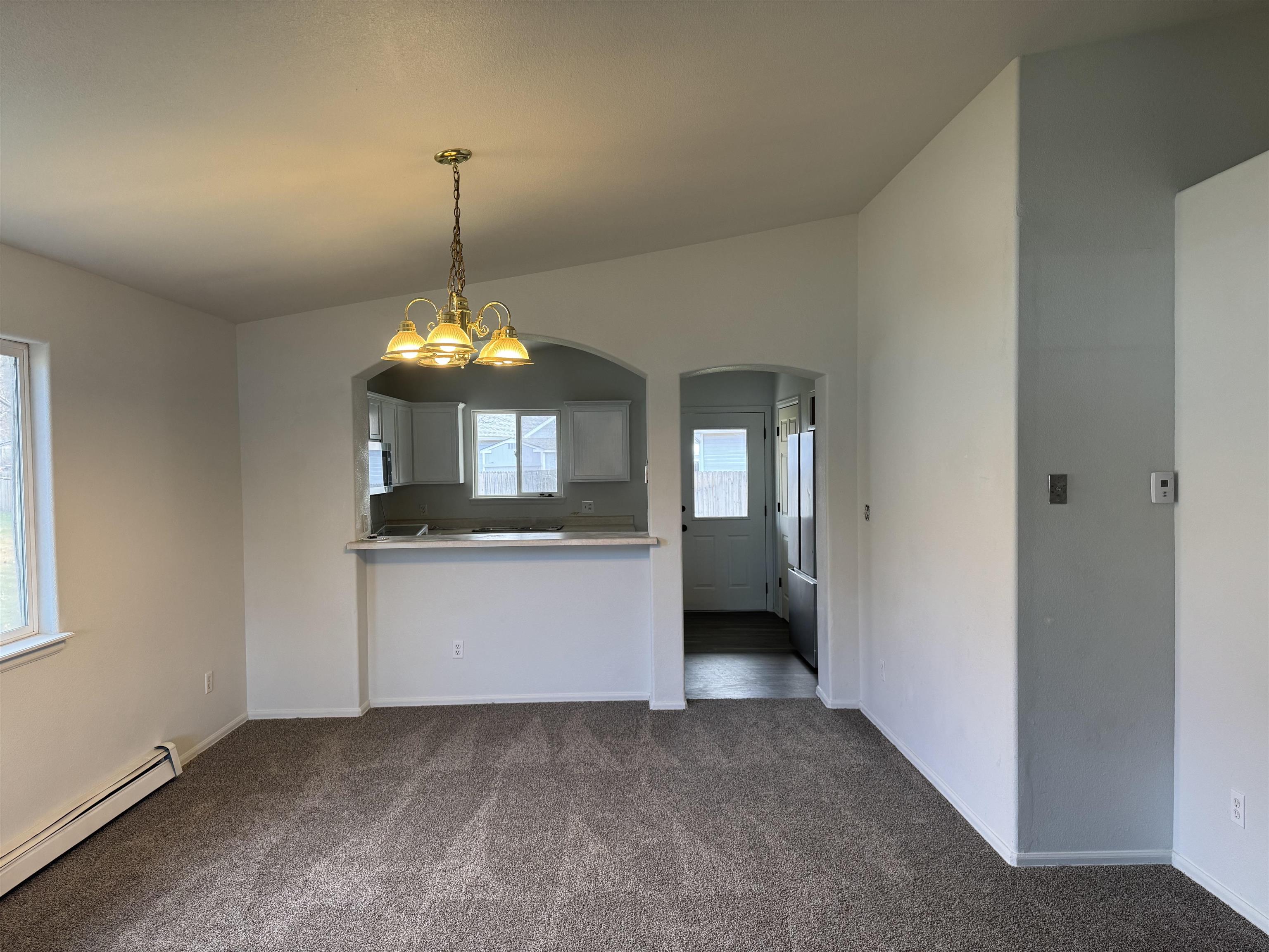 516 Vermont Lane Fruita, CO 81521 - Photo 6 of 13 a room with chandelier and entryway