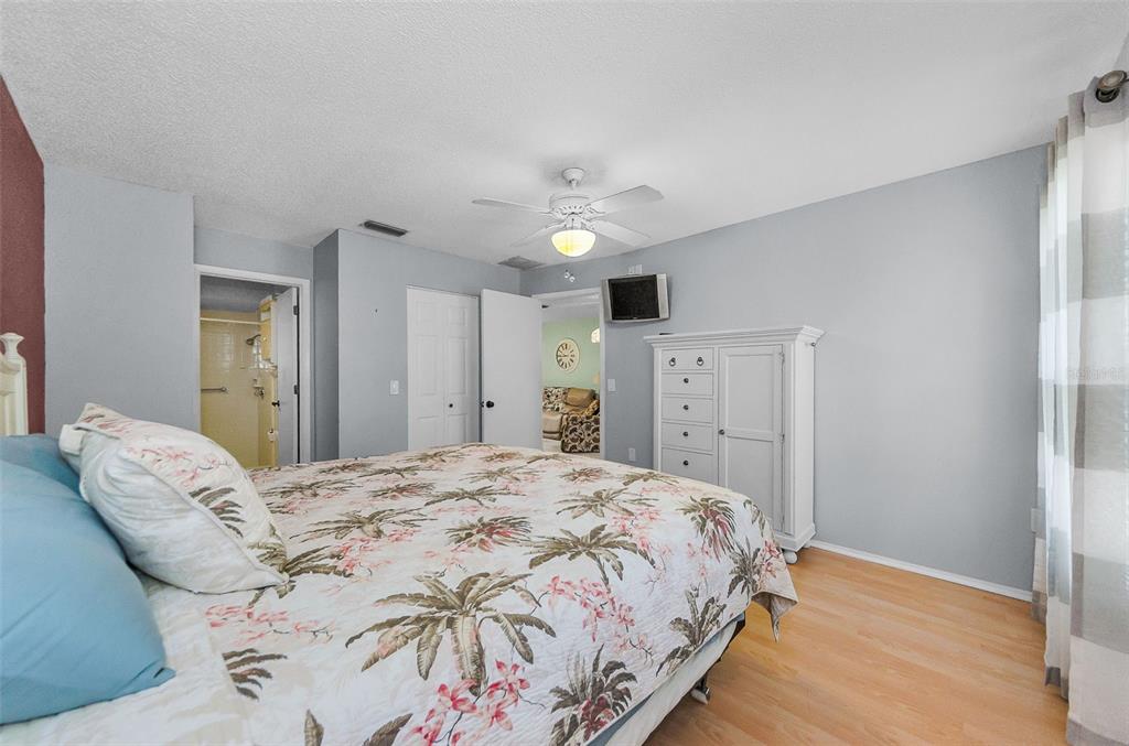 11516 Versailles Lane Port Richey, FL 34668 - Photo 21 of 41 a bedroom with a bed and a window