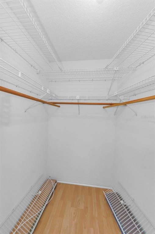 11516 Versailles Lane Port Richey, FL 34668 - Photo 23 of 41 a view of a room with wooden floor