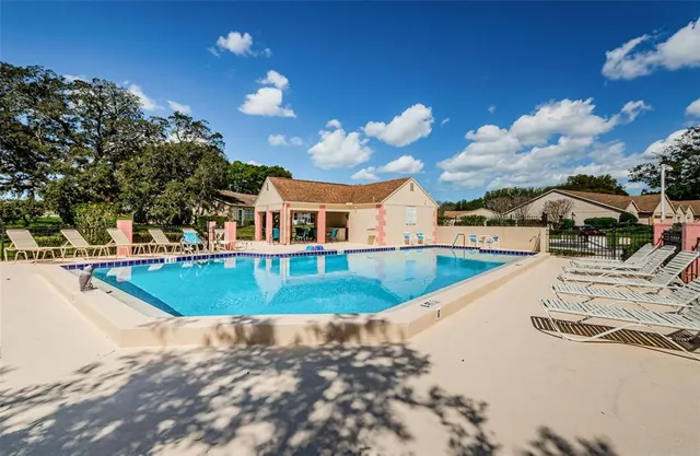 a view of a swimming pool with a patio