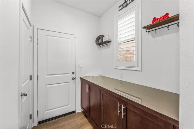 a view of a storage and utility room with a window