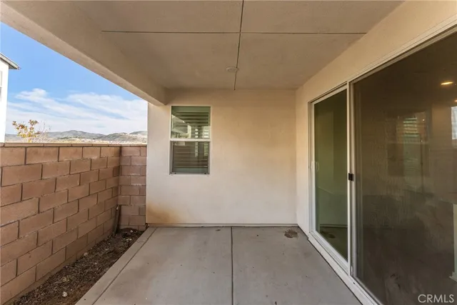 a view of a swimming pool with an outdoor seating and a garden