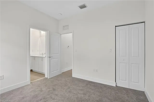 a view of a kitchen with a sink and a window