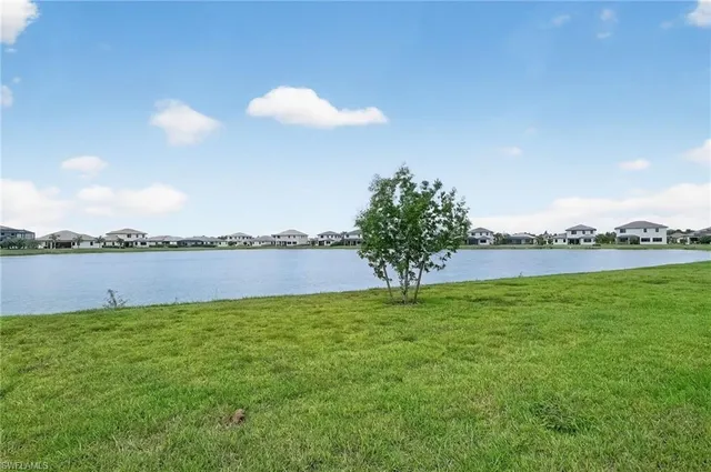 a view of a lake and a yard