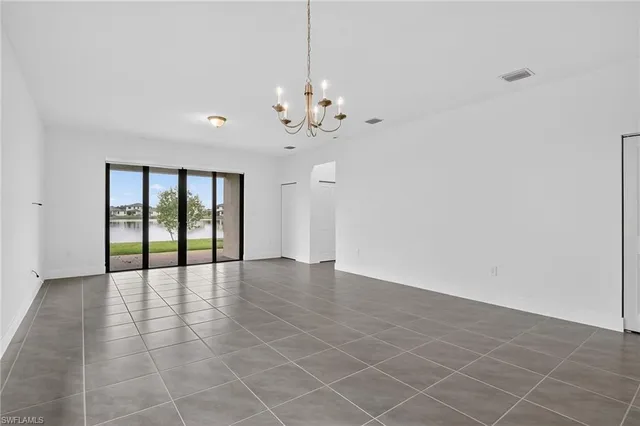 a view of a kitchen with a sink and a window