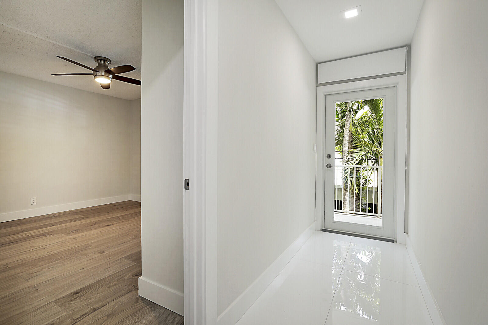 1439 South Ocean Boulevard, Unit 208 Lauderdale-by-the-Sea, FL 33062 - Photo 20 of 27 a view of an empty room with wooden floor and a window