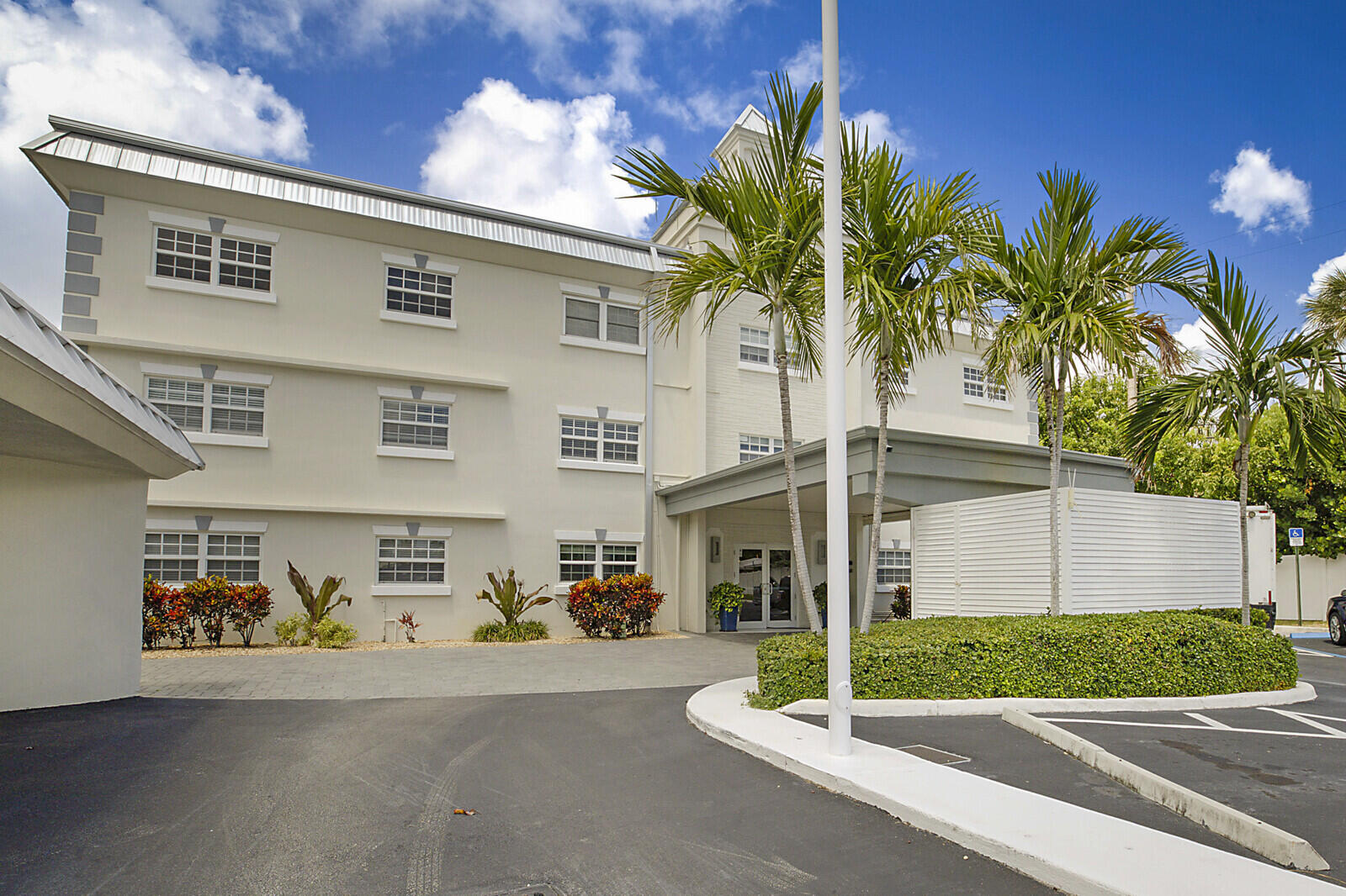 1439 South Ocean Boulevard, Unit 208 Lauderdale-by-the-Sea, FL 33062 - Photo 2 of 27 a view of a house with a street