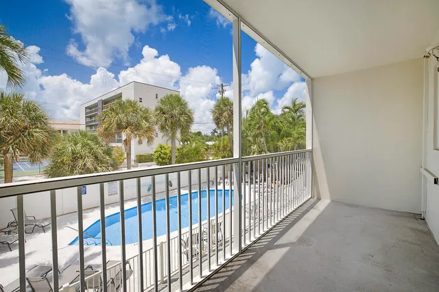 a view of a balcony with wooden floor