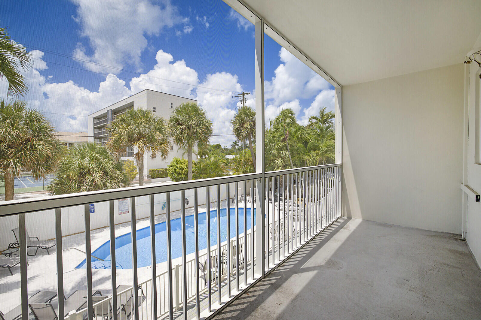 1439 South Ocean Boulevard, Unit 208 Lauderdale-by-the-Sea, FL 33062 - Photo 22 of 27 a view of a balcony with wooden floor
