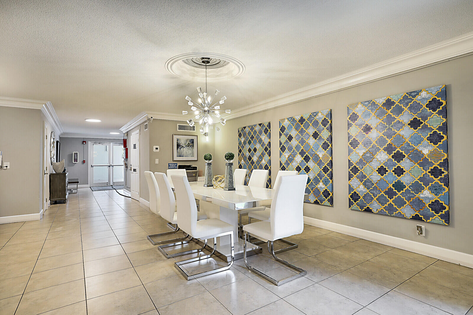 1439 South Ocean Boulevard, Unit 208 Lauderdale-by-the-Sea, FL 33062 - Photo 24 of 27 a view of a dining room with furniture and chandelier