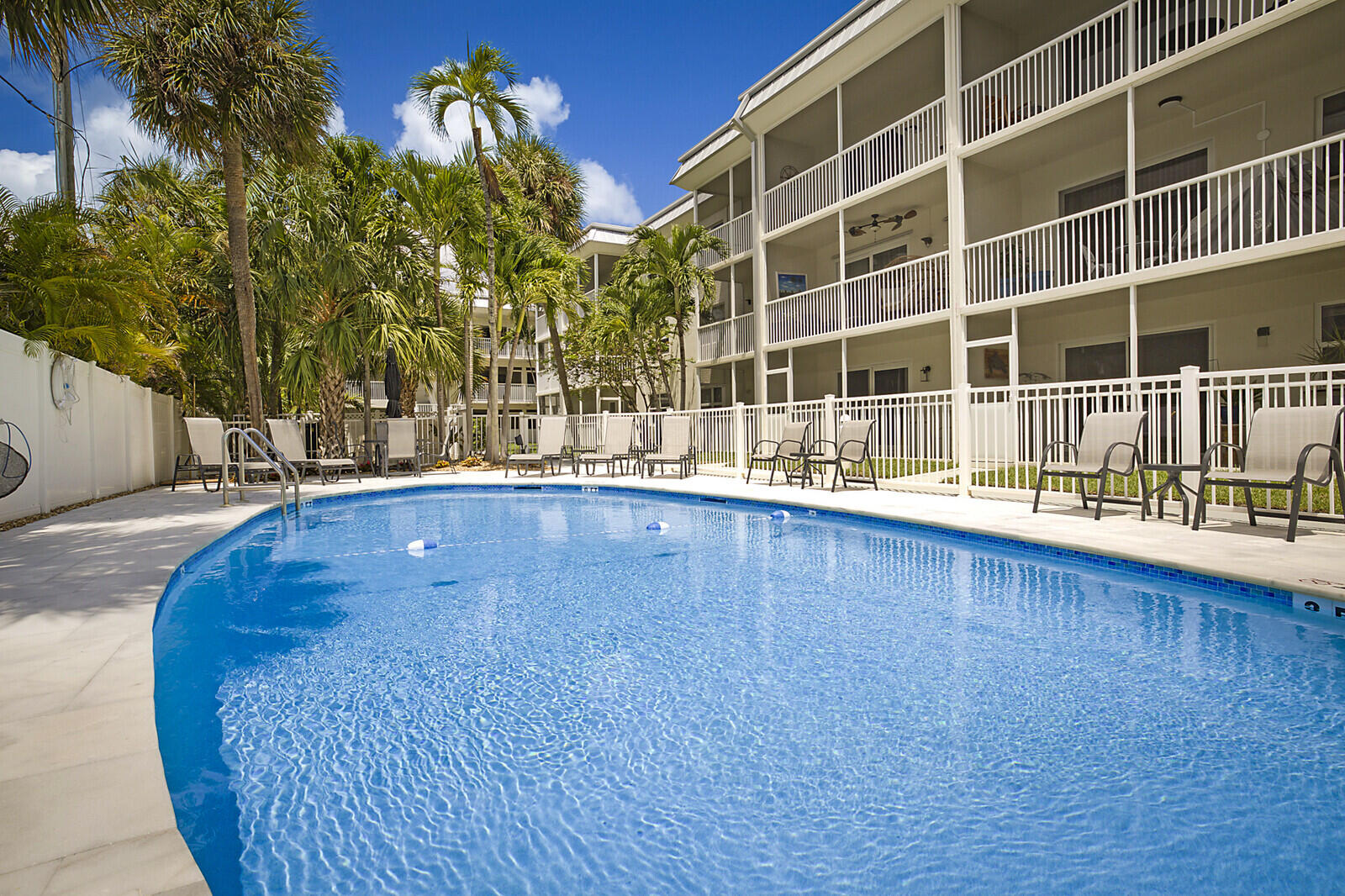 1439 South Ocean Boulevard, Unit 208 Lauderdale-by-the-Sea, FL 33062 - Photo 25 of 27 a view of a swimming pool with an outdoor space