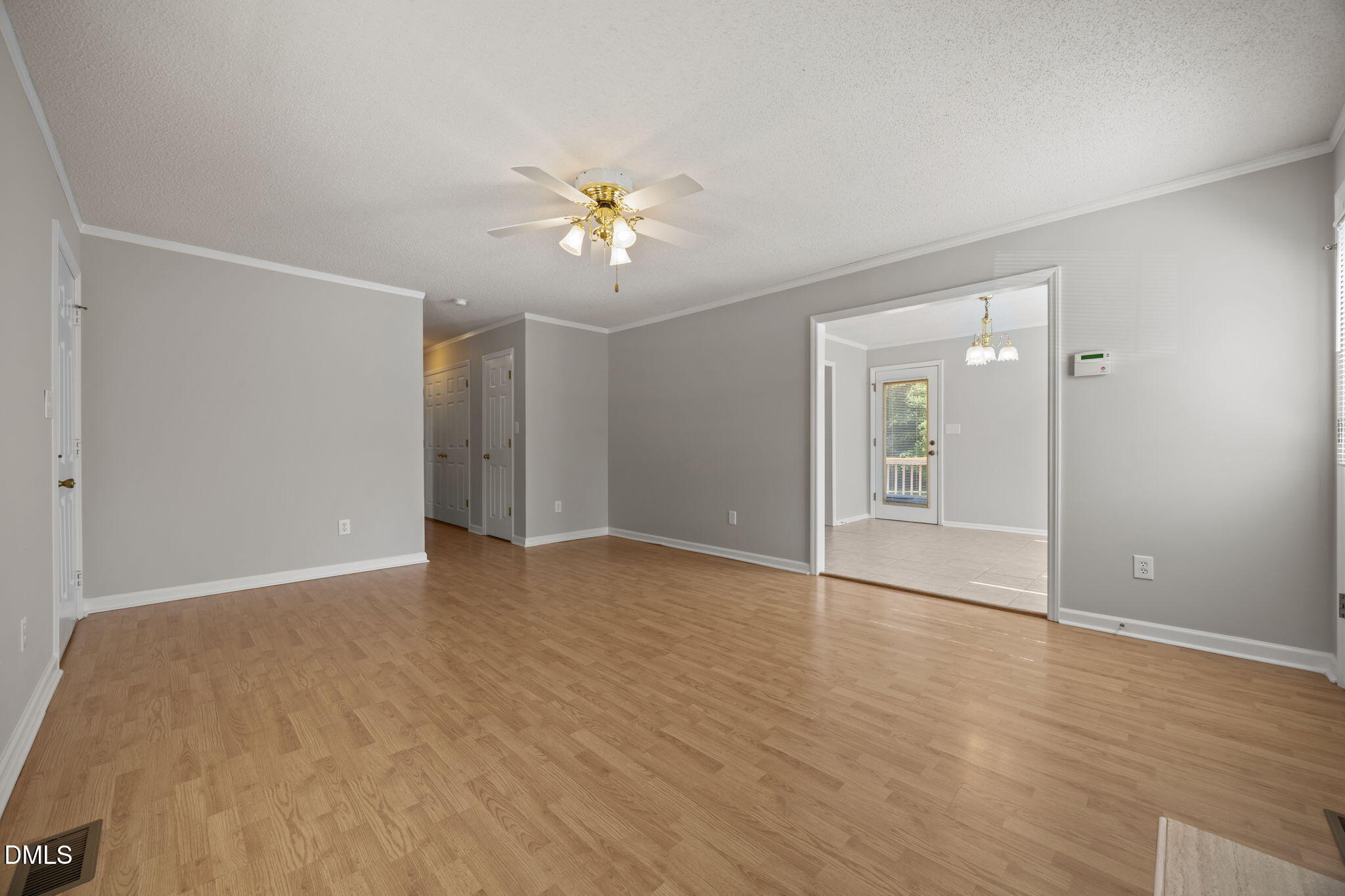 40 Circle Tree Lane Angier, NC 27501 - Photo 6 of 39 a view of an empty room with wooden floor and a ceiling fan
