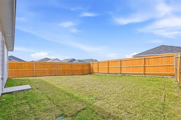 a view of a large building with a yard