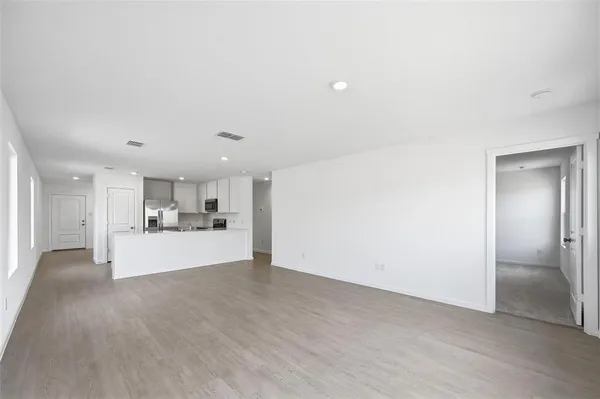 a view of a kitchen with a sink and cabinets