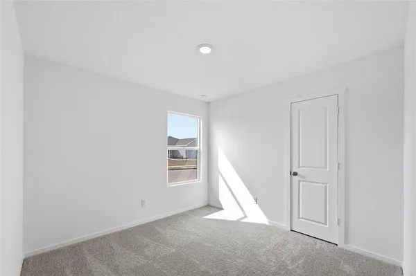 a view of empty room with windows