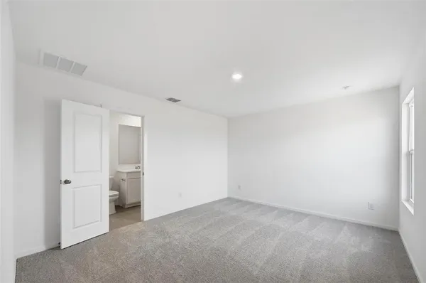 an empty room with closet area