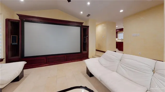 a bedroom with a bed and a large mirror