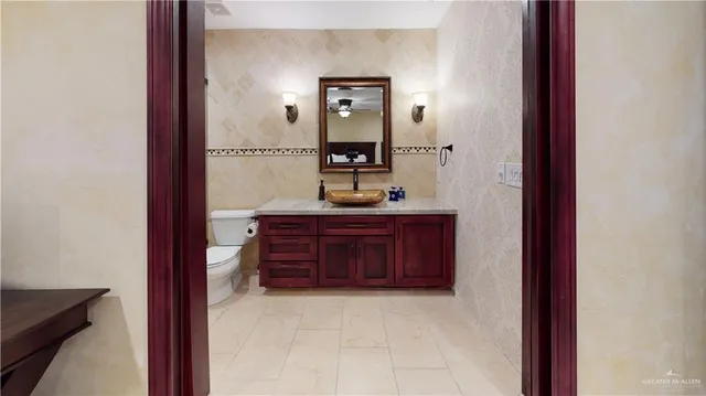 a bathroom with a toilet and shower