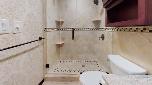 a view of a dining table and chairs in the patio