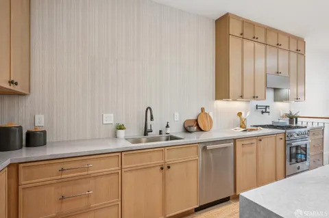 a bedroom with two beds and a lamp