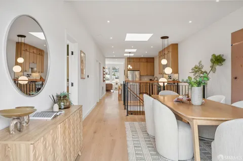 a utility room with cabinets washer and dryer