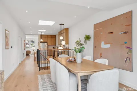 a view of a chairs and tables in the back yard of the house
