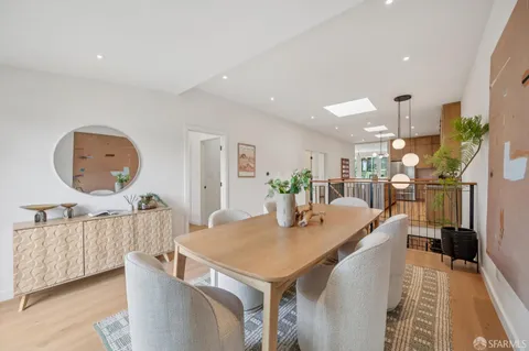 a view of a white building among the windows