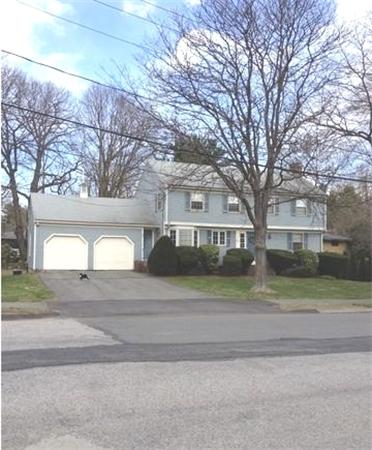 122 Worthen Road Lexington, MA 02421 - Photo 1 of 6 a front view of house with yard and green space