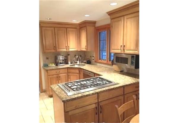 122 Worthen Road Lexington, MA 02421 - Photo 2 of 6 a kitchen that has a sink and a stove in it