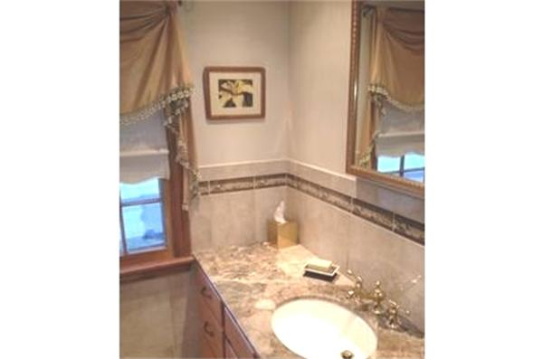 122 Worthen Road Lexington, MA 02421 - Photo 5 of 6 a bathroom with a granite countertop sink and a mirror