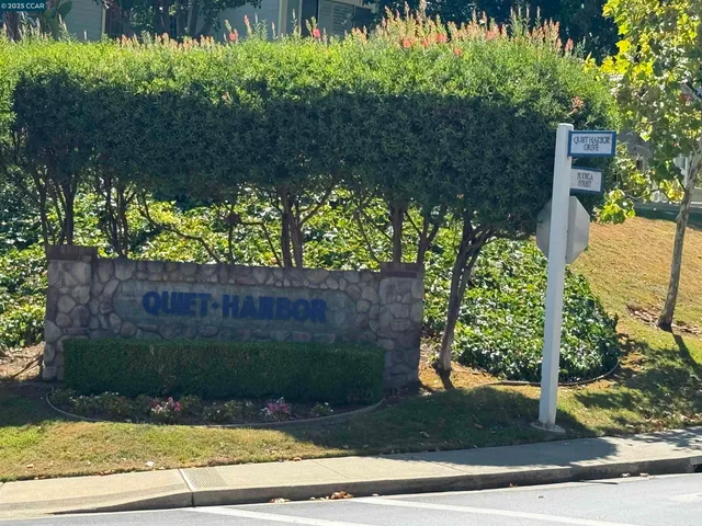 a view of a houses with a lake and mountain view