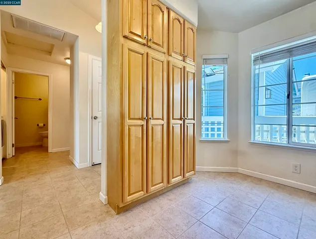 a kitchen with a sink a counter space and cabinets