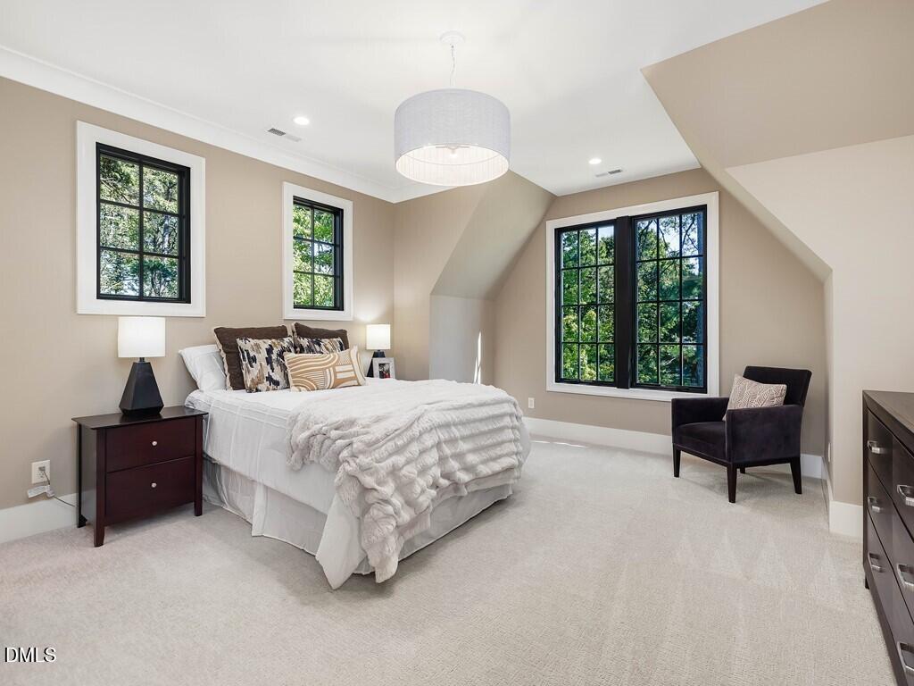 7013 Buckhead Drive Raleigh, NC 27615 - Photo 43 of 80 a bedroom with a bed and a couch