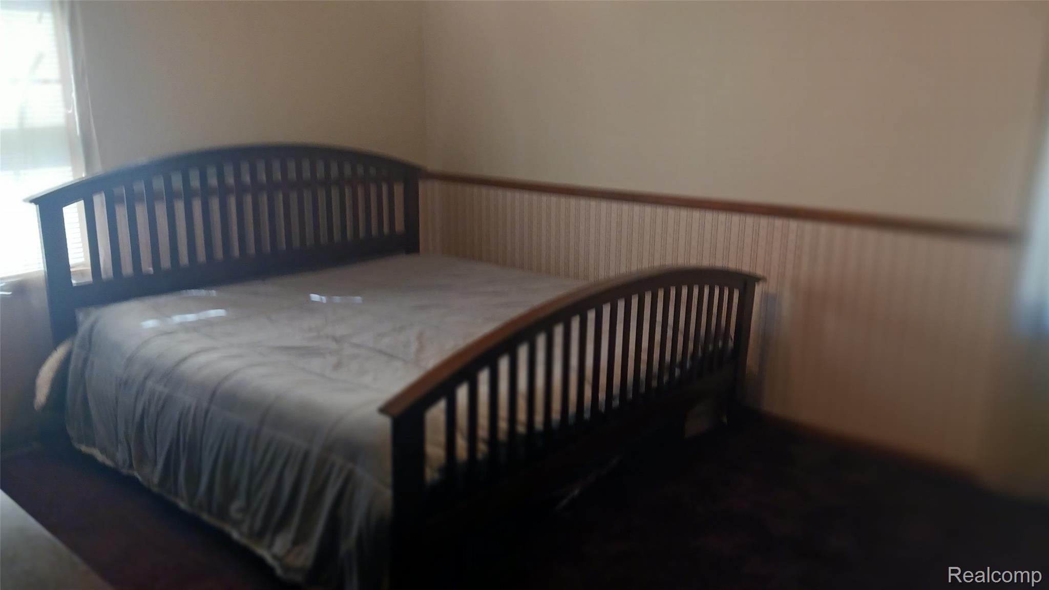 3803 Warner Road Cass City, MI 48726 - Photo 27 of 85 Bedroom with multiple windows and a wainscoted wall
