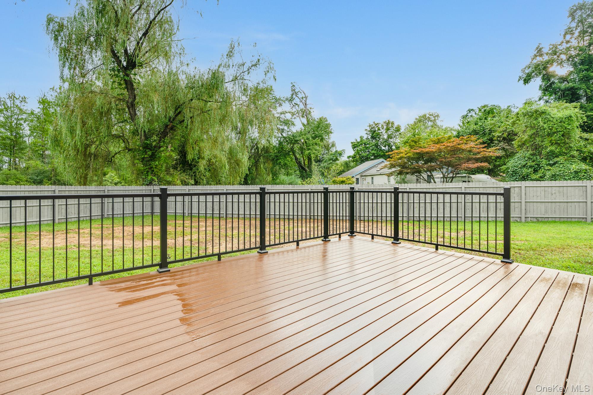 3167 Lincoln Drive Mohegan Lake, NY 10547 - Photo 13 of 34 a view of wooden deck and a garden