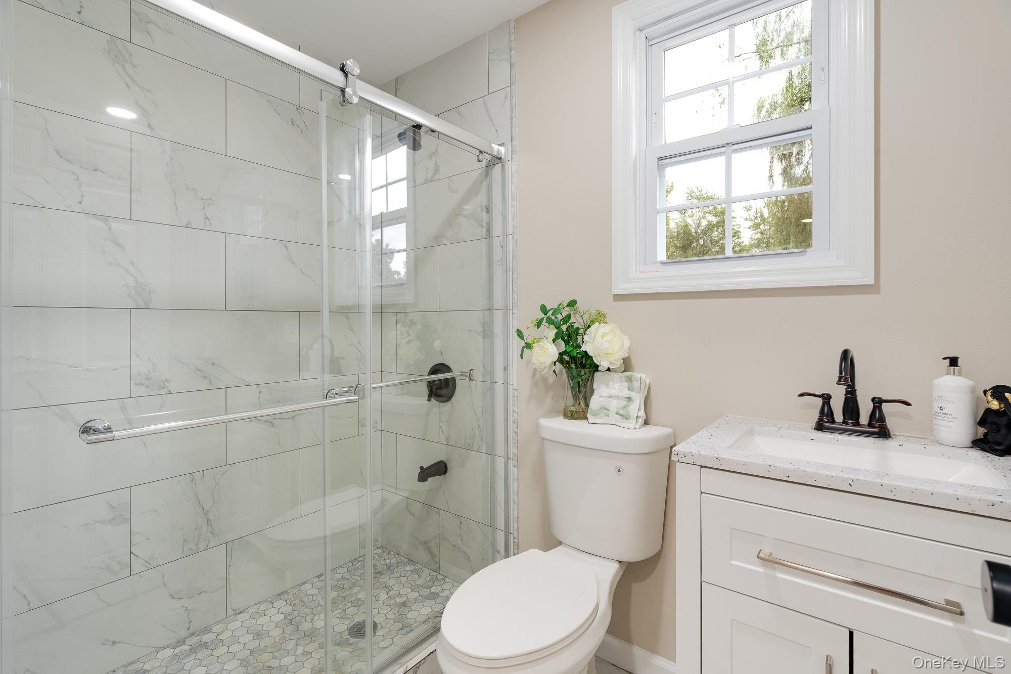 3167 Lincoln Drive Mohegan Lake, NY 10547 - Photo 21 of 34 a bathroom with a sink toilet and shower